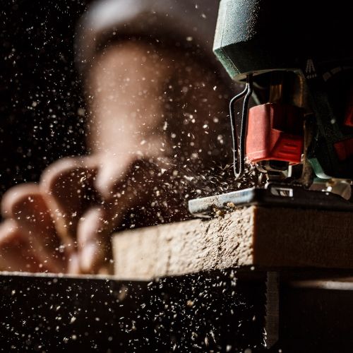 close-up-photo-cutting-wood-with-fretsaw